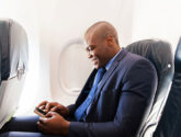 JETS man smiling in airplane
